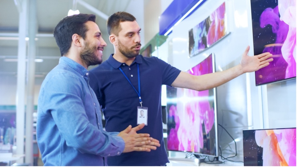 A couple of men looking at a screen