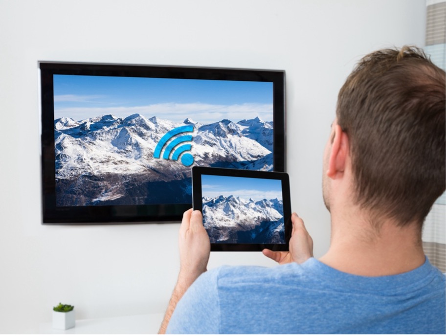 A person and person looking at a tv screen