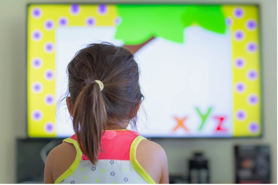 A child watching a screen