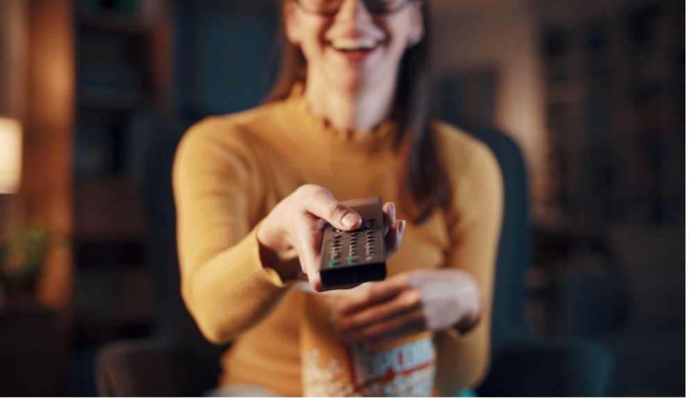 A person holding a remote control